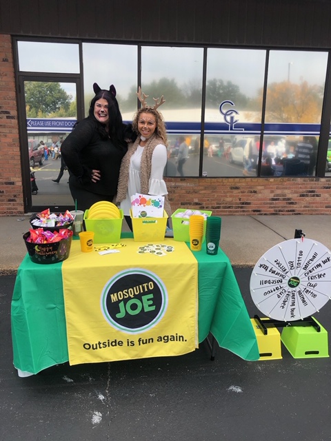 Mosquito Joe represantives giving out candy at a Halloween Trunk or Treat Event